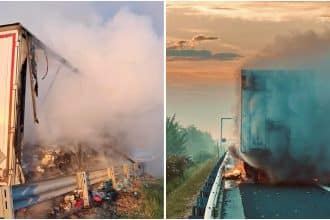 Autospeciale de pompieri intervenind pe banda de urgență a autostrăzii A1 pentru stingerea unui incendiu izbucnit la un autotren.