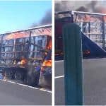 Semiremorcă de autotren cuprinsă de flăcări violente și coloană de fum negru pe banda de urgență a autostrăzii A1.