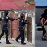 Mascați și polițiști de la Transporturi Feroviare blocând o stradă din Sânandrei în timpul executării unor mandate de percheziție domiciliară.