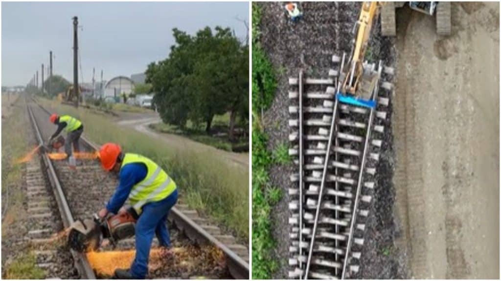 Excavatoare și utilaje grele lucrând la nivelarea terasamentului feroviar golit de șine între Ghiroda și Pădurea Verde.