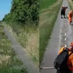 Tronson degradat din pista de biciclete Timișoara - Zrenjanin, prezentând fisuri în asfalt și vegetație crescută prin covorul de rulare.