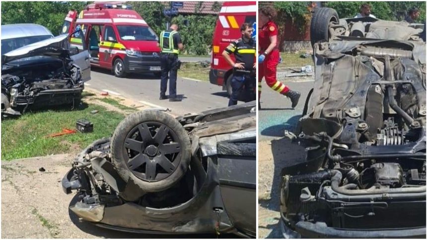 Autoturism răsturnat pe plafon, cu roțile în sus, în urma unui impact violent în localitatea Șiria din județul Arad, în timpul intervenției de descarcerare.
