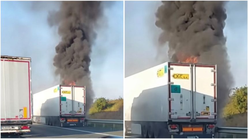 Remorca unui TIR cuprinsă de flăcări pe autostrada A1 Arad–Timișoara, cu un nor gros de fum deasupra șoselei